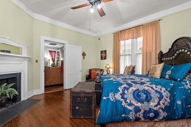 bedroom featuring ceiling fan and dark hardwood / wood-style flooring