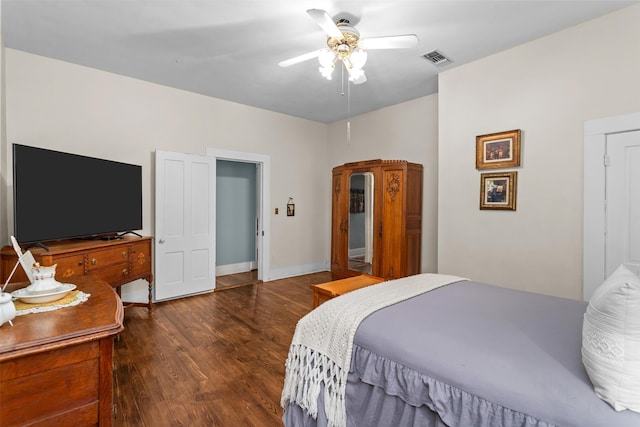 bedroom featuring ceiling fan and dark hardwood / wood-style floors