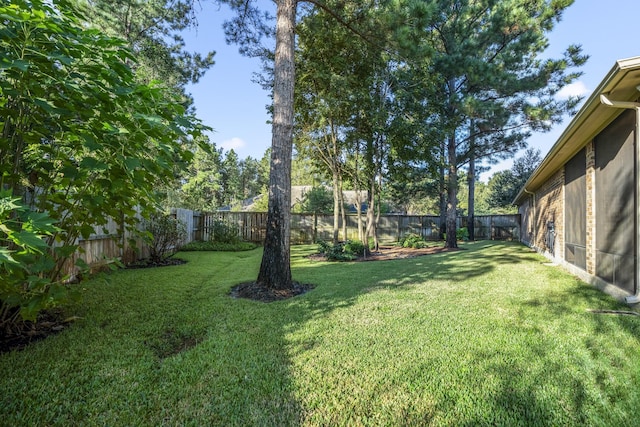 view of yard with a fenced backyard