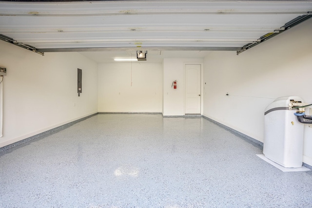 garage featuring electric panel, baseboards, and a garage door opener