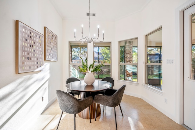 dining space with ornamental molding, light tile patterned floors, and an inviting chandelier