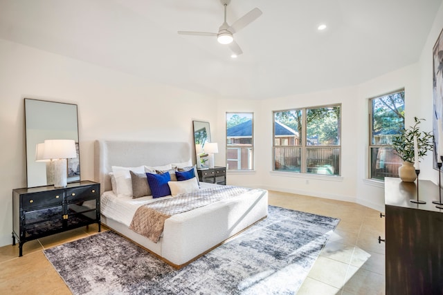 bedroom featuring light tile patterned flooring and ceiling fan