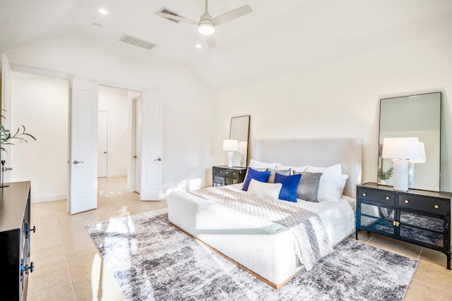 bedroom with vaulted ceiling, light tile patterned floors, and ceiling fan