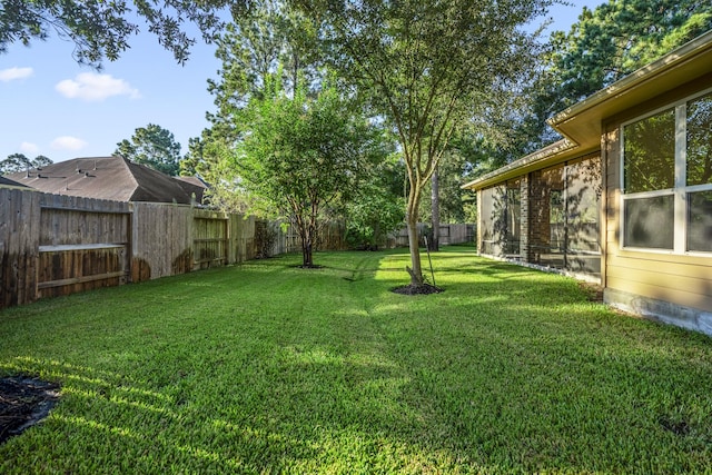 view of yard with a fenced backyard