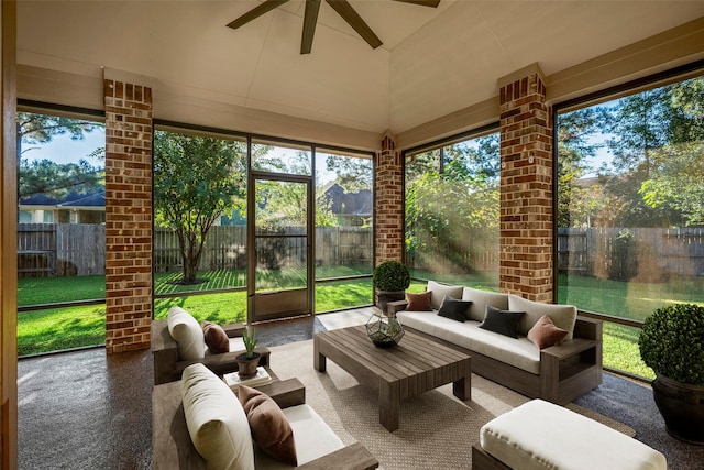 sunroom / solarium featuring plenty of natural light and ceiling fan