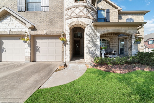 view of front of home with a front yard and a garage