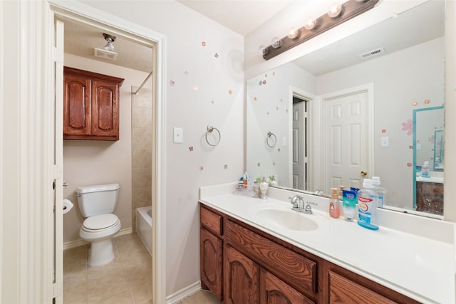 full bathroom with tile patterned floors, tiled shower / bath combo, vanity, and toilet