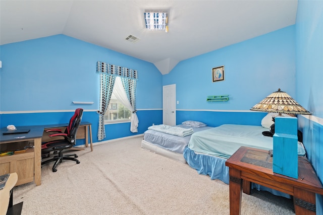 bedroom featuring carpet floors and lofted ceiling