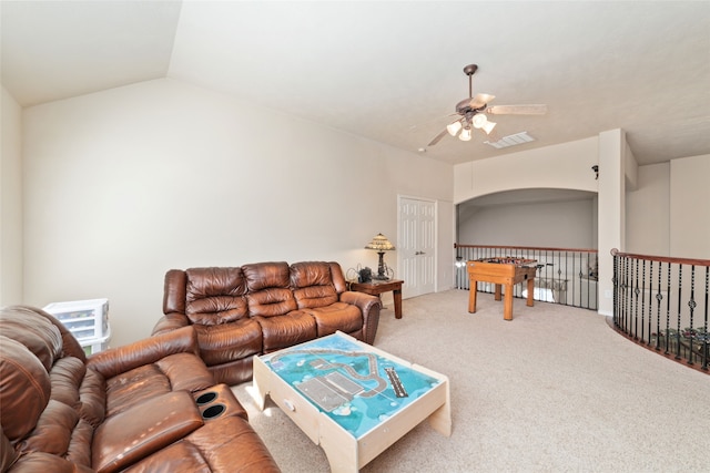 living room with carpet floors, lofted ceiling, and ceiling fan