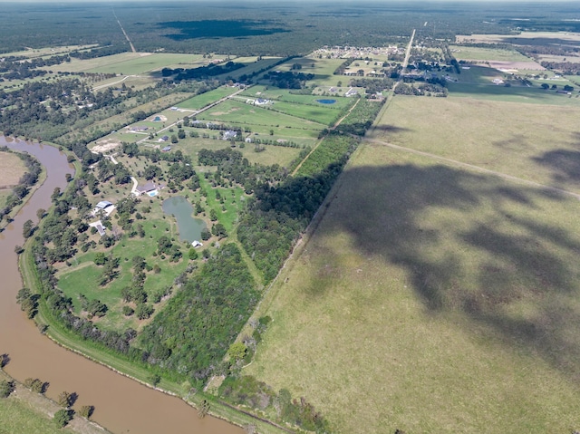 bird's eye view with a water view and a rural view