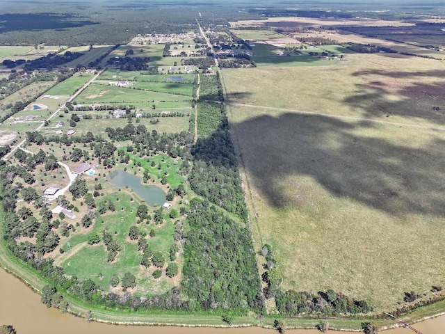 aerial view with a rural view and a water view