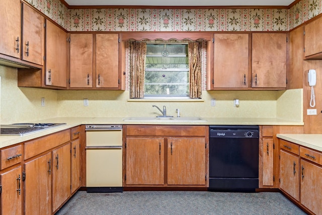 kitchen featuring dishwasher, dark colored carpet, stainless steel gas stovetop, and sink