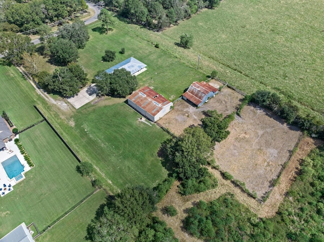 birds eye view of property with a rural view