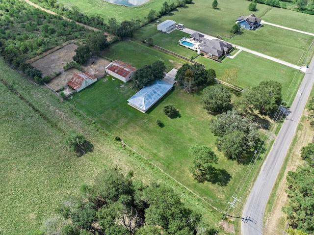 birds eye view of property with a rural view