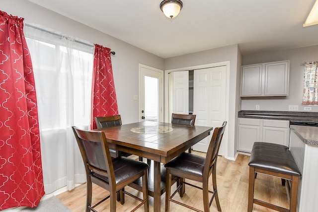 dining space featuring light wood-type flooring