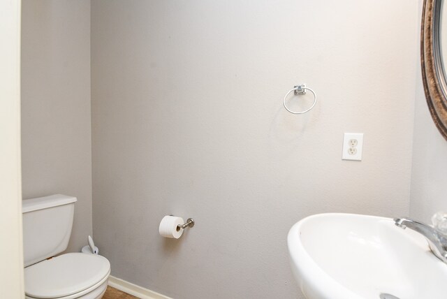 bathroom with sink and toilet