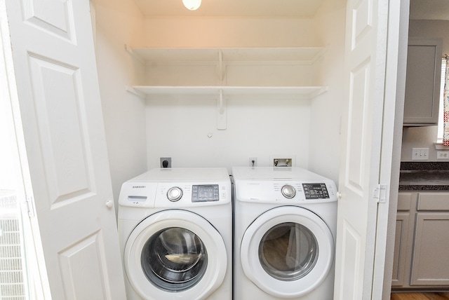 clothes washing area with washer and dryer