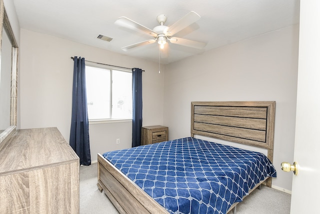 bedroom featuring ceiling fan, light colored carpet, and a closet