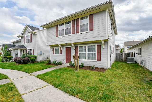 view of front of property featuring central AC unit and a front yard