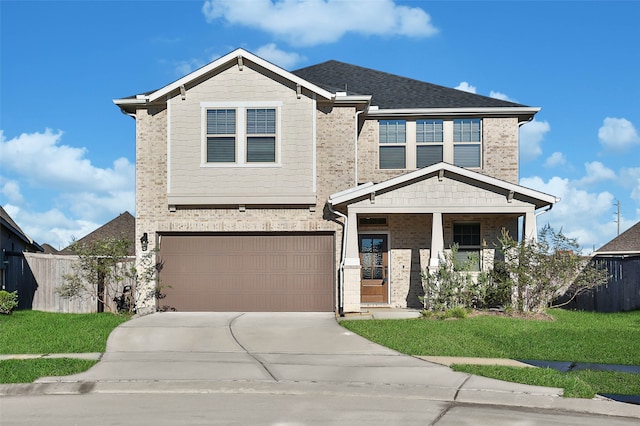 view of front of home featuring a garage and a front lawn