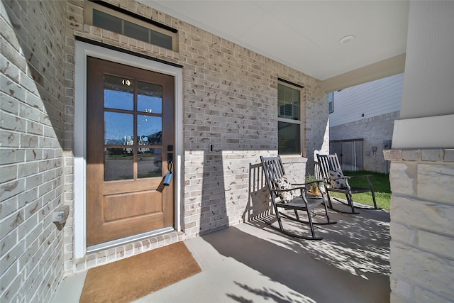 entrance to property featuring a porch