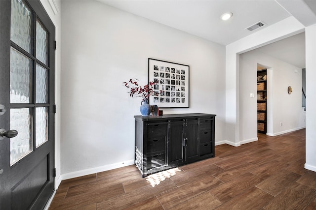 foyer entrance with dark hardwood / wood-style flooring