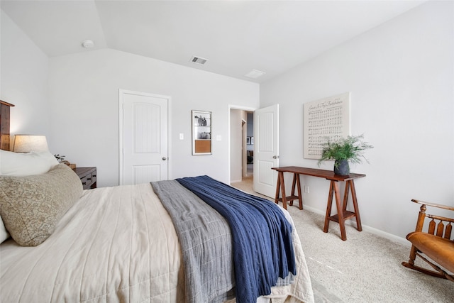 bedroom with carpet and lofted ceiling