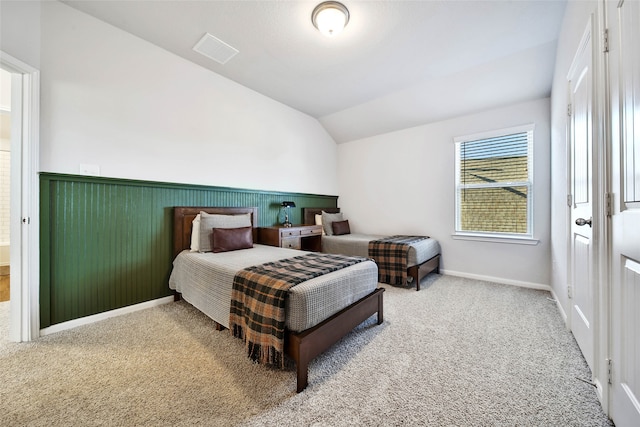 carpeted bedroom featuring vaulted ceiling