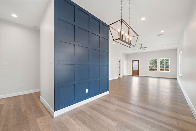 unfurnished room with light hardwood / wood-style floors and ceiling fan