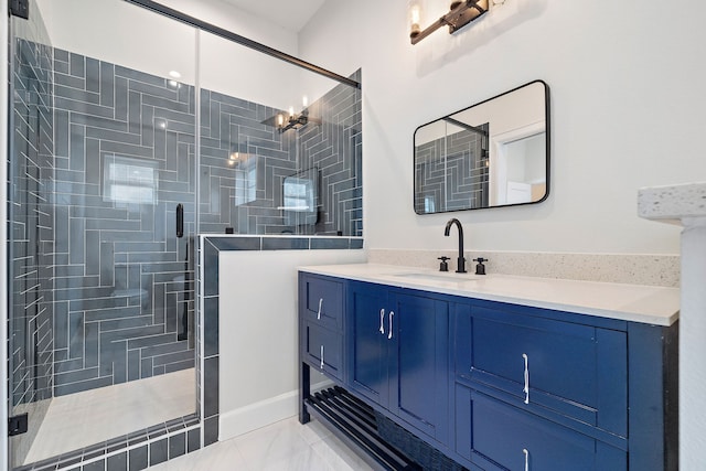 bathroom featuring vanity and a shower with shower door