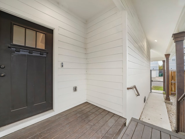 view of exterior entry featuring a deck