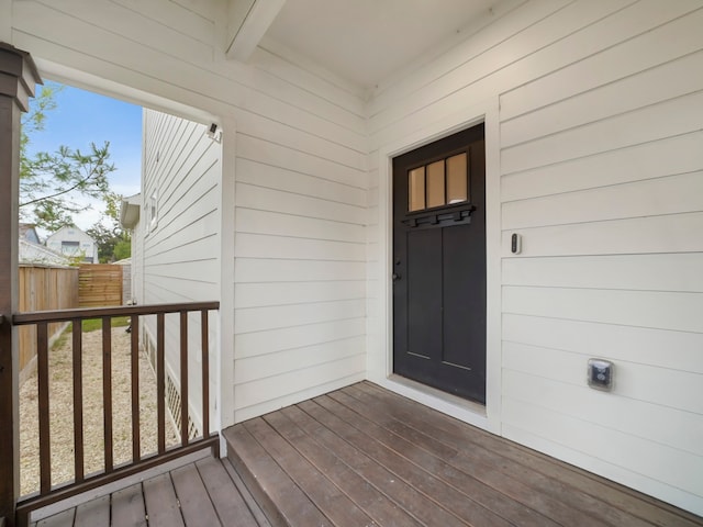 property entrance with a wooden deck