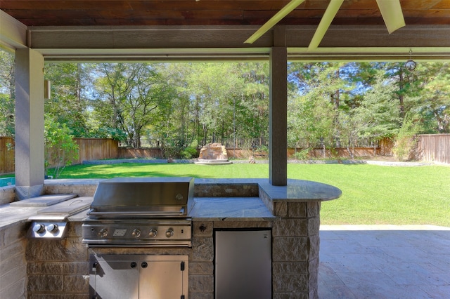 view of patio featuring grilling area and an outdoor kitchen