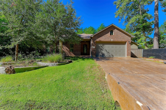 view of front of house with a front yard and a garage