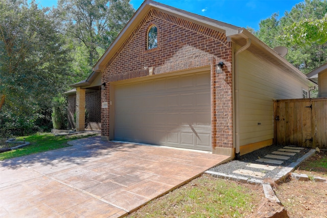 view of side of property with a garage