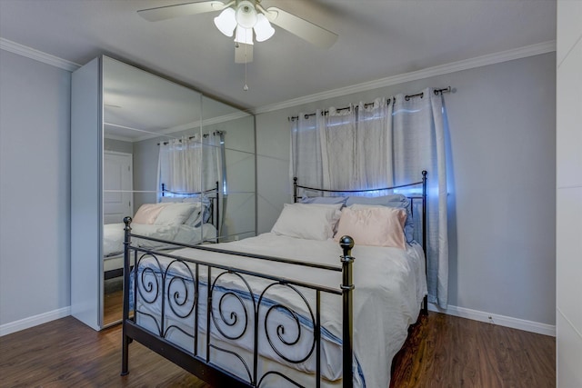 bedroom with crown molding, ceiling fan, and dark wood-type flooring