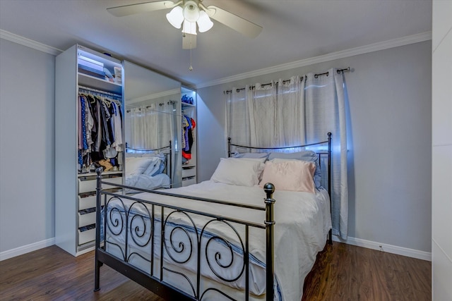 bedroom with ceiling fan, dark hardwood / wood-style floors, crown molding, and a closet