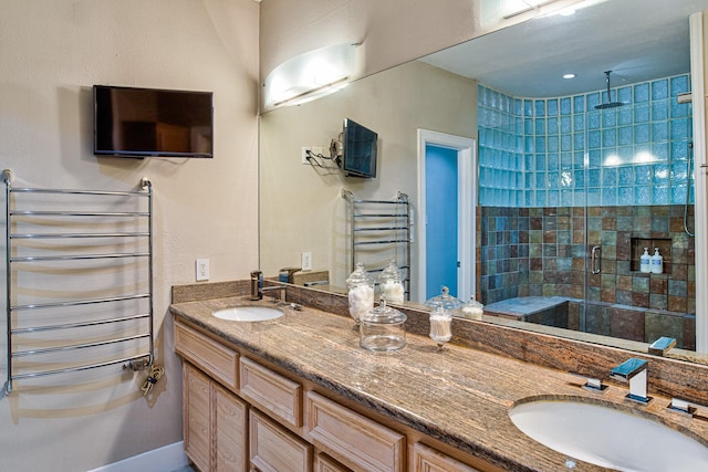 bathroom featuring an enclosed shower, vanity, and radiator heating unit