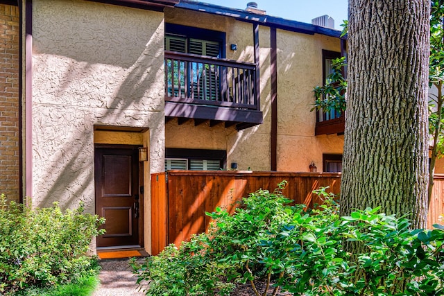 back of property with a balcony