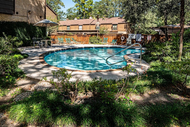 view of swimming pool featuring a patio area