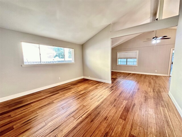 interior space featuring light wood-type flooring, lofted ceiling, and ceiling fan