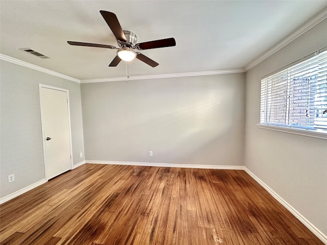 unfurnished room featuring ceiling fan, crown molding, and hardwood / wood-style floors