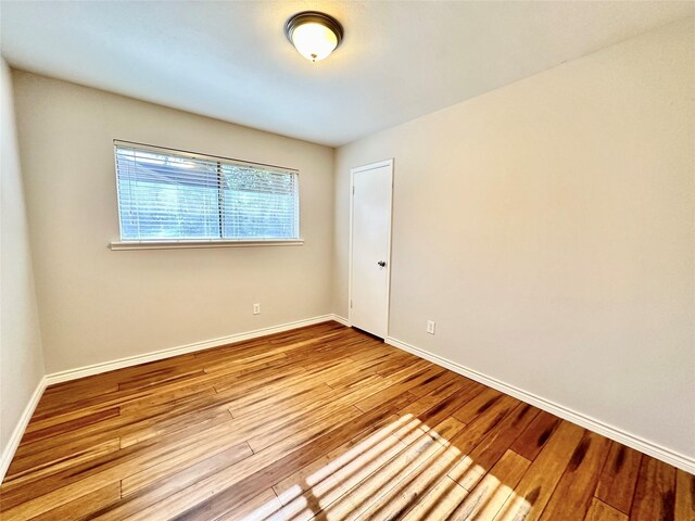 unfurnished room with light hardwood / wood-style flooring