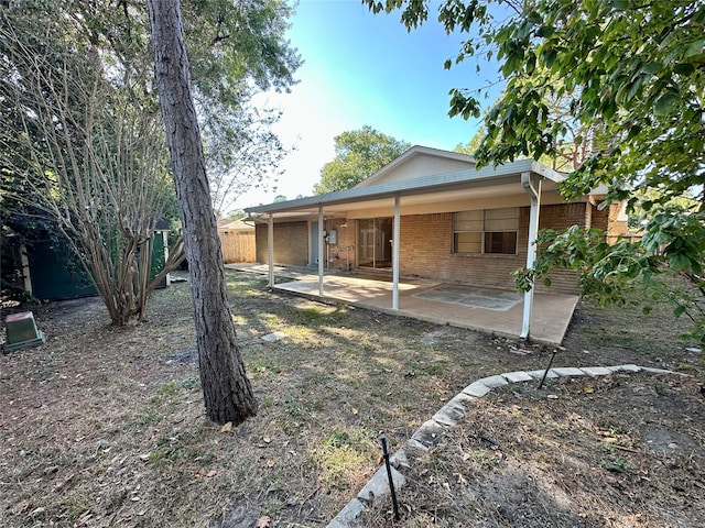 back of house featuring a patio area