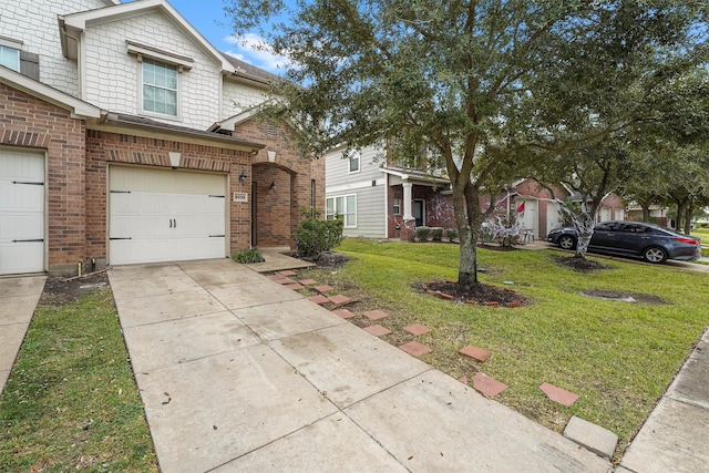 view of property featuring a front lawn and a garage