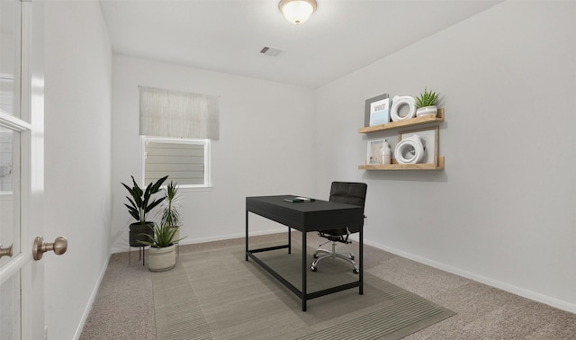 office area featuring light carpet