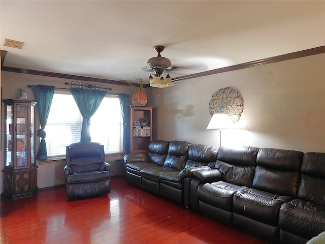 living room featuring ornamental molding, ceiling fan, and dark hardwood / wood-style flooring