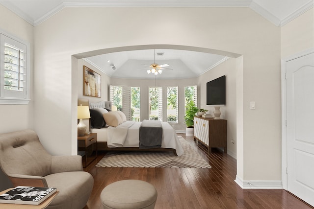 bedroom featuring multiple windows, ornamental molding, and dark hardwood / wood-style flooring