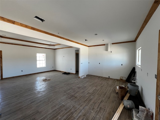 spare room with crown molding and dark hardwood / wood-style flooring