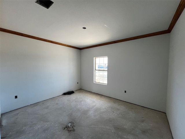 unfurnished room with crown molding